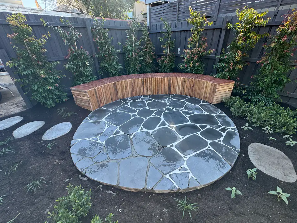 Circular bluestone crazy-paved patio laid by GardenScaping in Carlton North